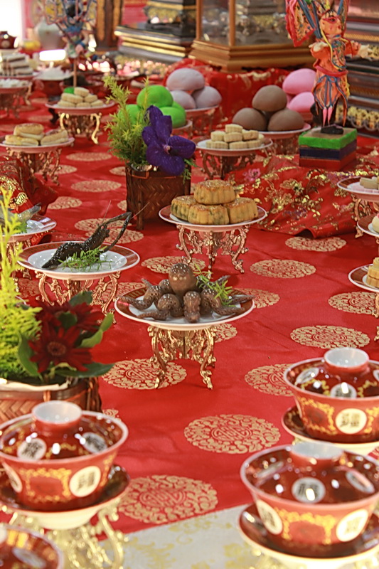 plates and bowls on a table with food on them