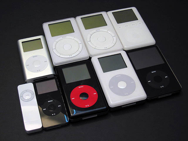 five different ipods lined up in a row