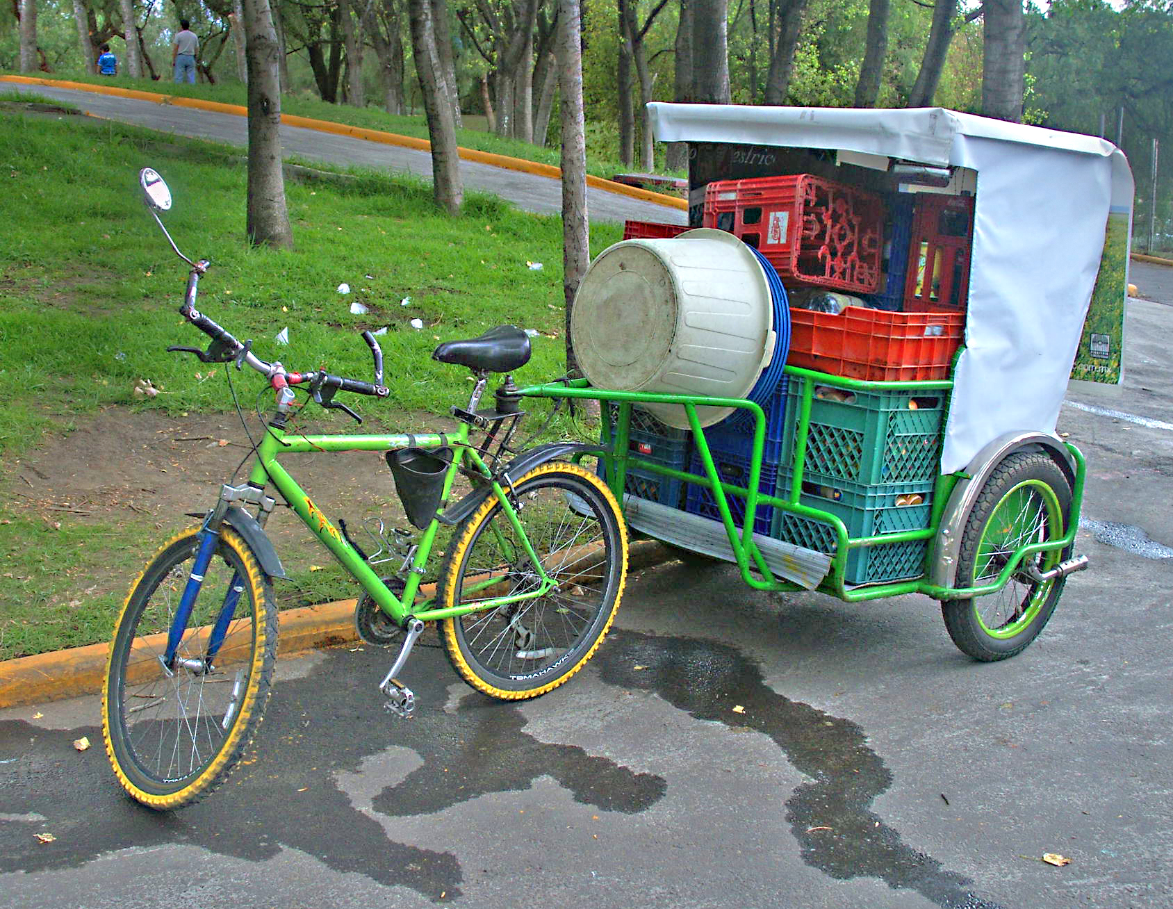 a bicycle with a basket parked in the parking lot