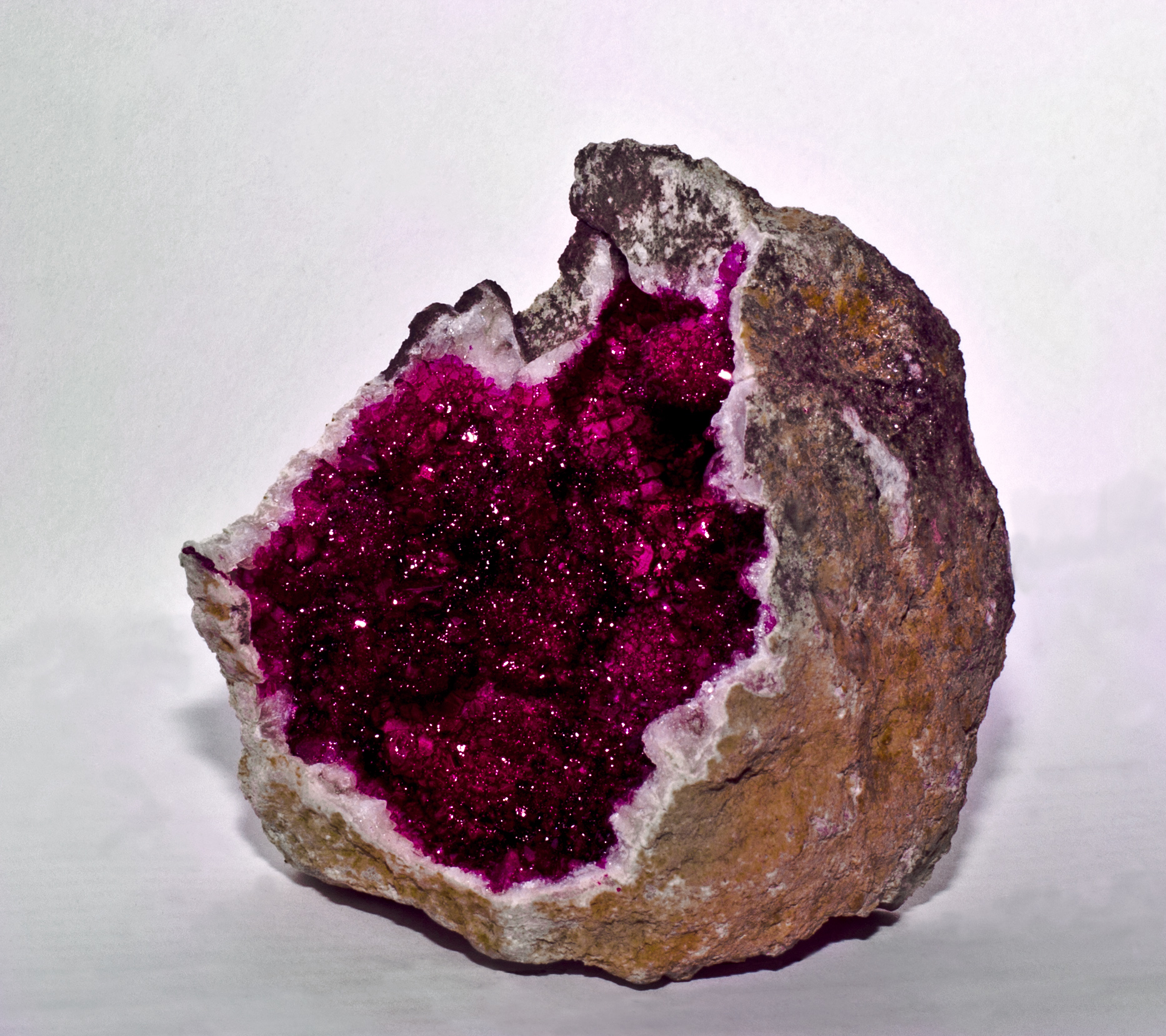a piece of granite that looks like a pink piece of material with purple streaks