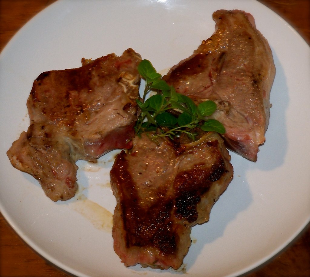 a plate with some meat and vegetables on it