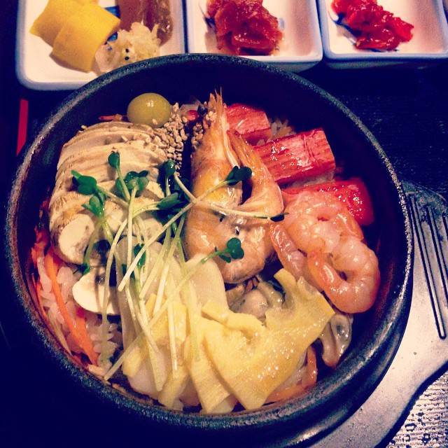 bowl with shrimp and other food on table top