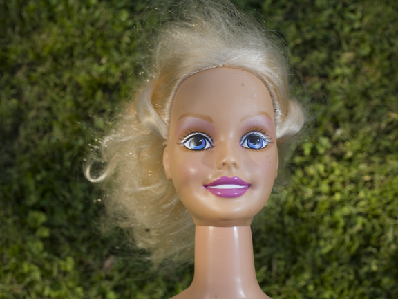 a doll has her hair in her bun