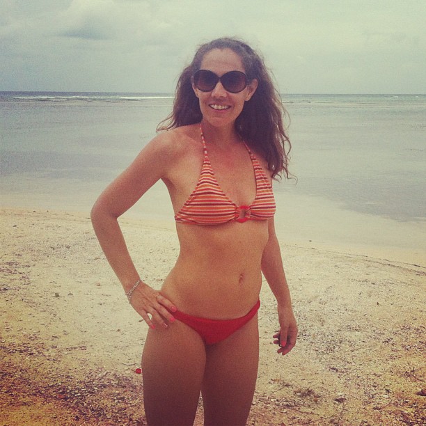 a girl in a bikini on the beach