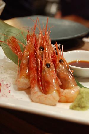 shrimp with dipping sauce on white plate