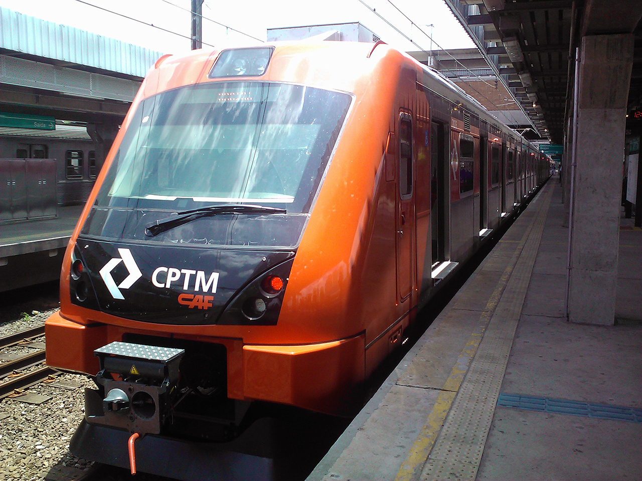 a commuter train stopped at the station with the platform and platform empty