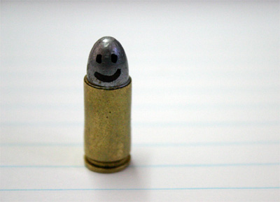 a small bullet has a smiling face on it