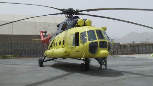 the large helicopter is yellow and black