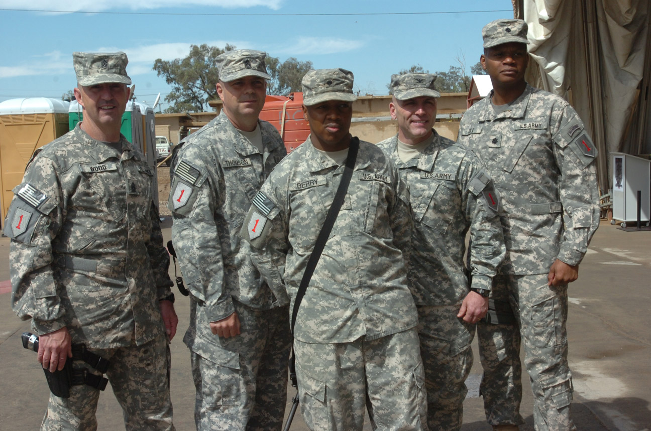 some men in uniform standing next to each other