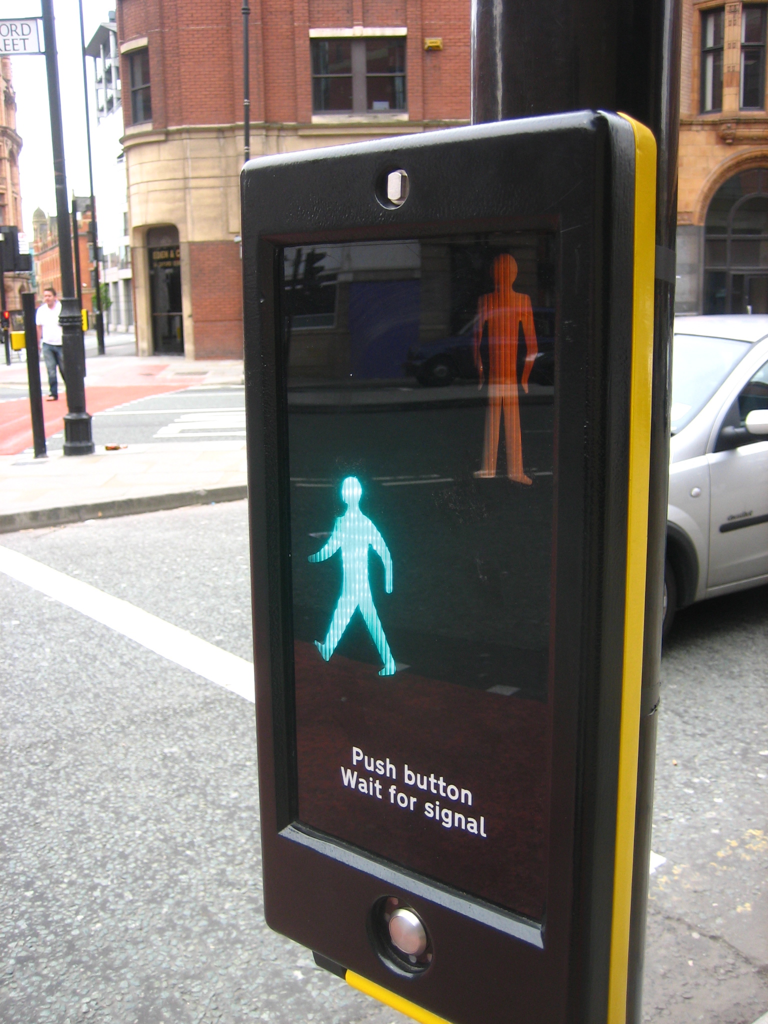 a walk sign on the side of a street