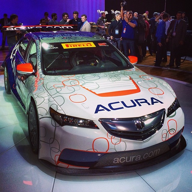 an acura vehicle with a colorful advertit on the hood