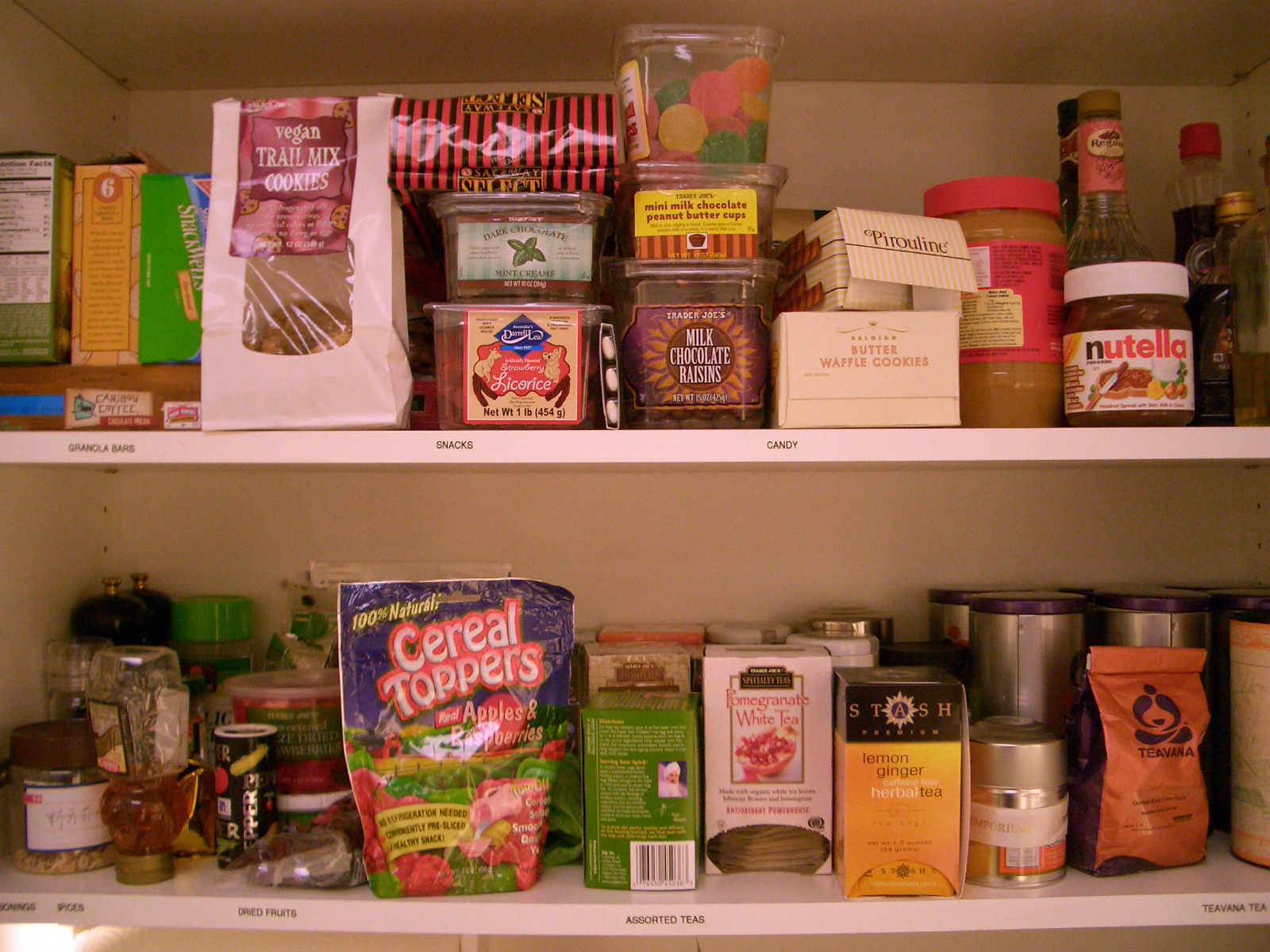 shelves displaying several types of food in containers