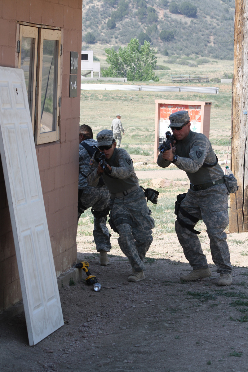 soldiers in camouflage shooting at the target