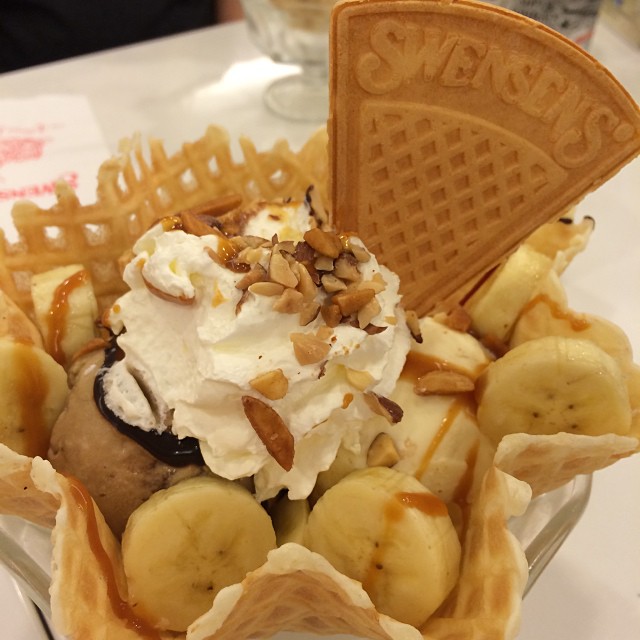 a waffle with fruit and nuts on top