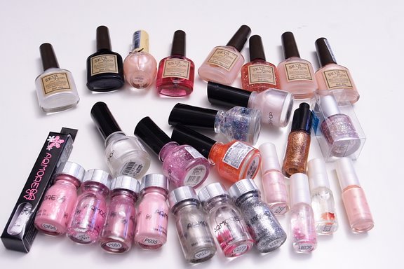 a bunch of nail polish bottles sitting next to each other