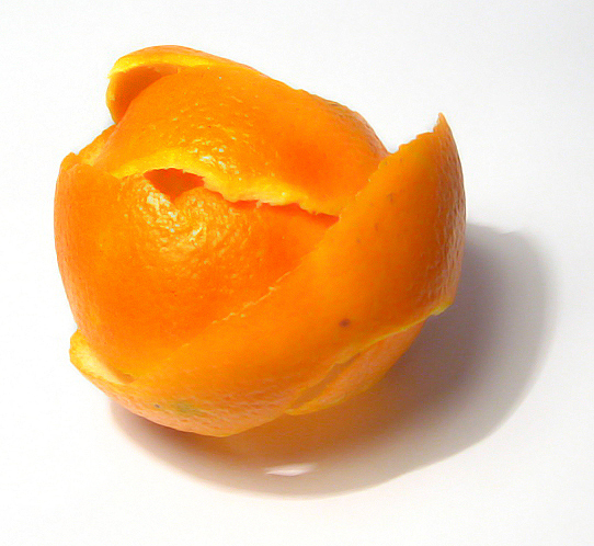 an orange with some one in it's center