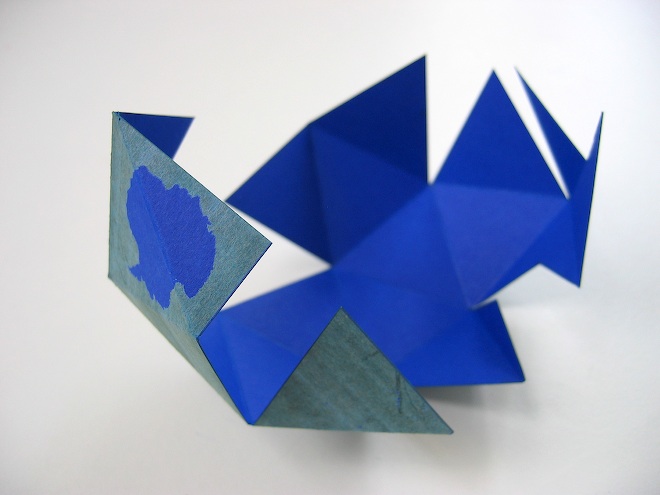 the paper model is shaped to look like an object