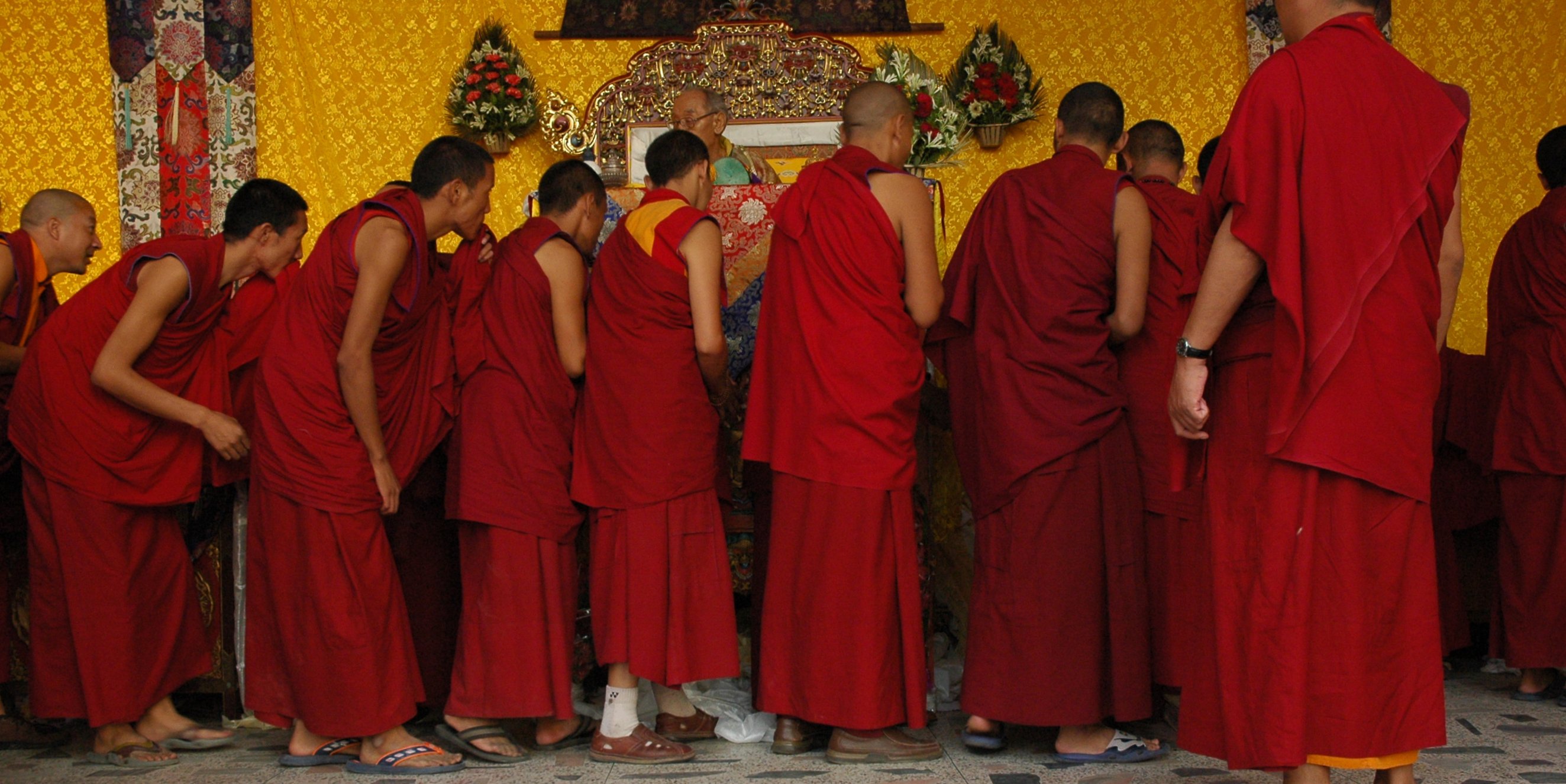 the monks are bowing their heads down