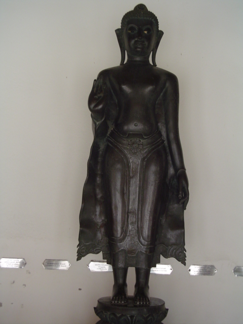 a statue that looks like it is standing with its hand in her pockets