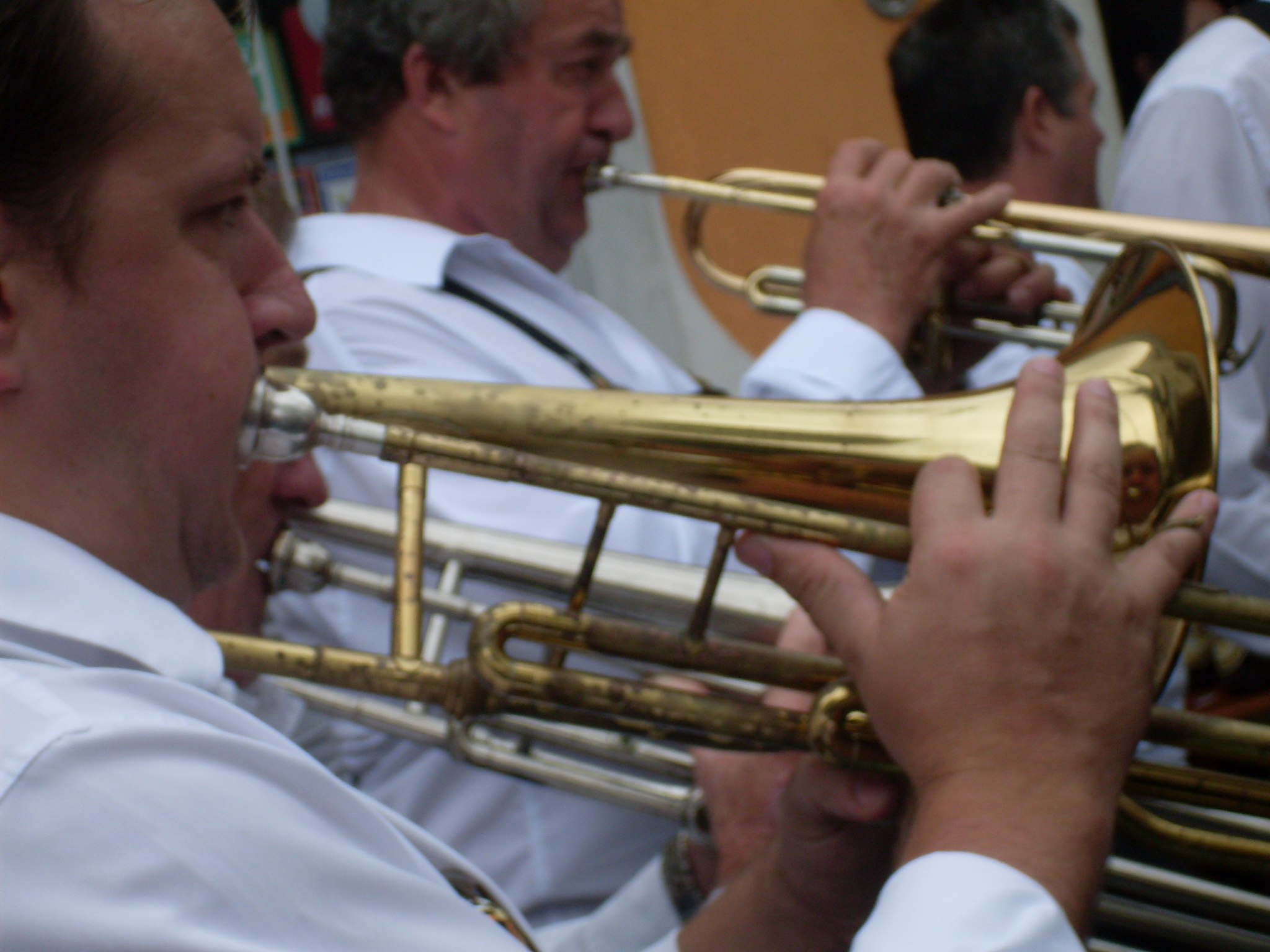 a group of people play ss instruments in a marching band