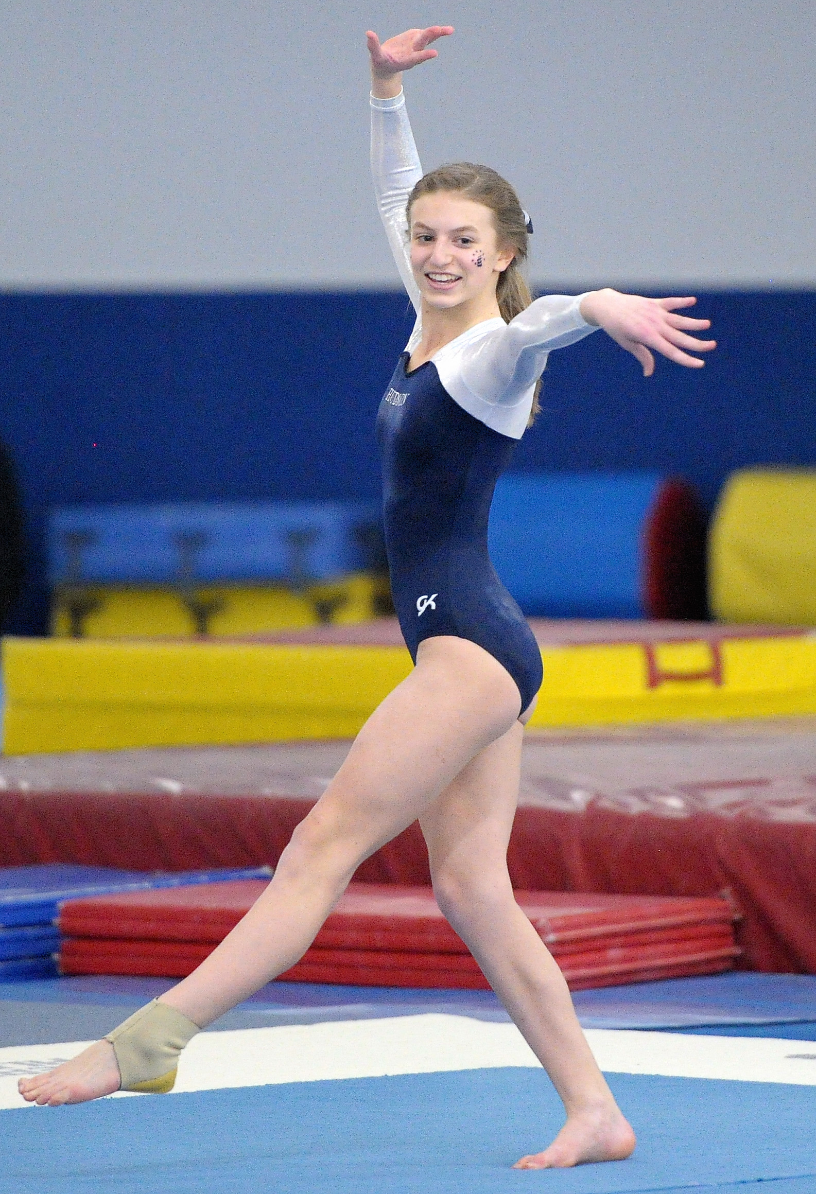 a  balances on her balance ball