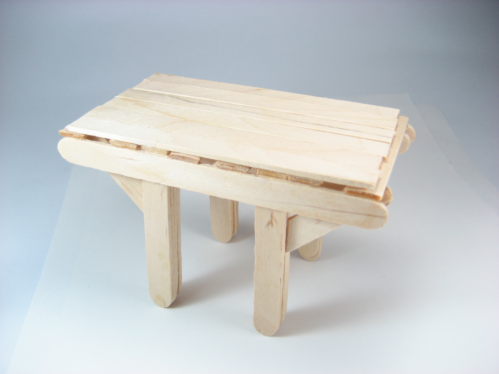 the wooden bench is ready to be used as a stool