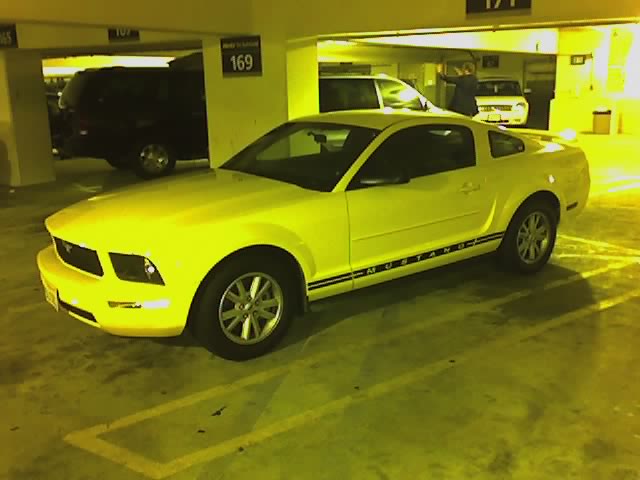 an illuminated po of a yellow ford mustang