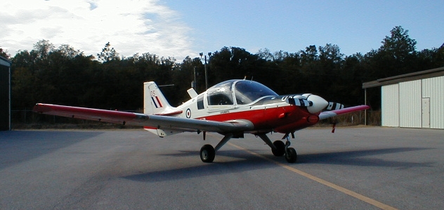 a small aircraft on the runway at the airport