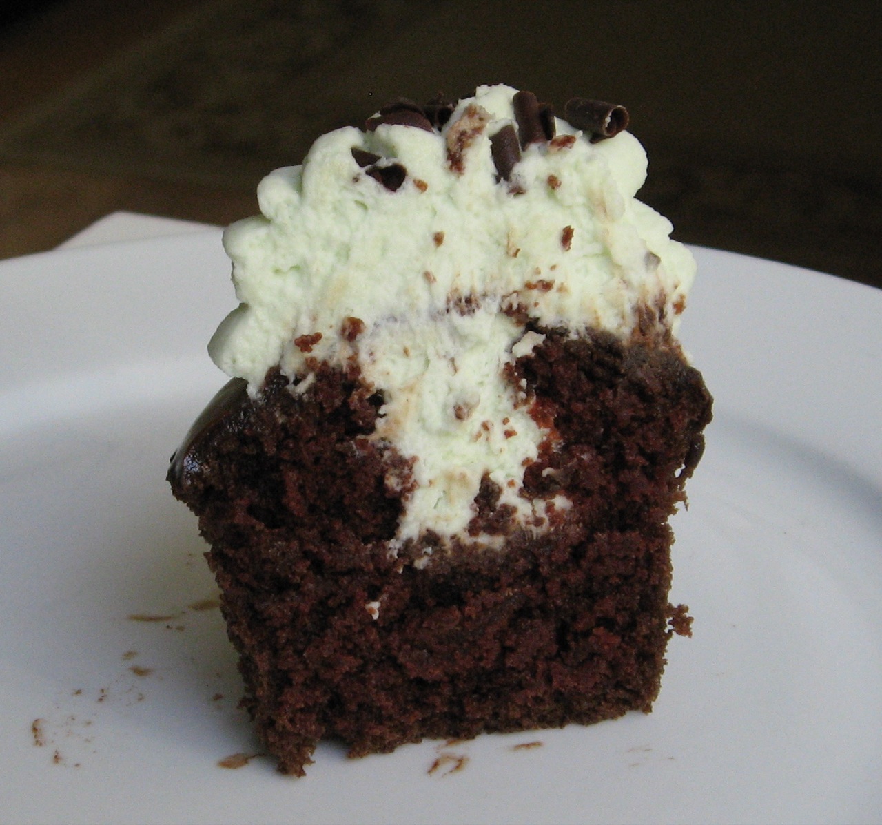 a chocolate cake on a white plate on the table