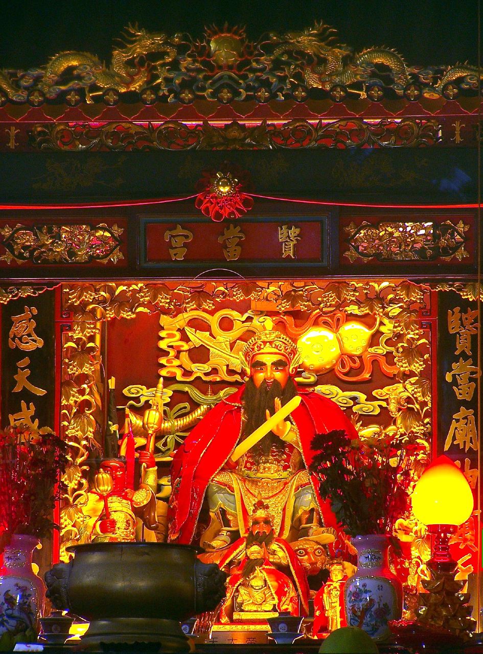 an ornate shrine with some lighting on it