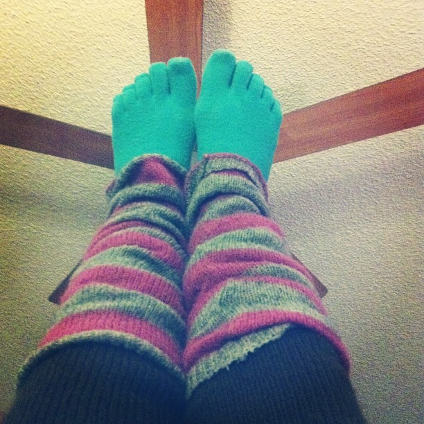 the legs and ankles of a person wearing socks