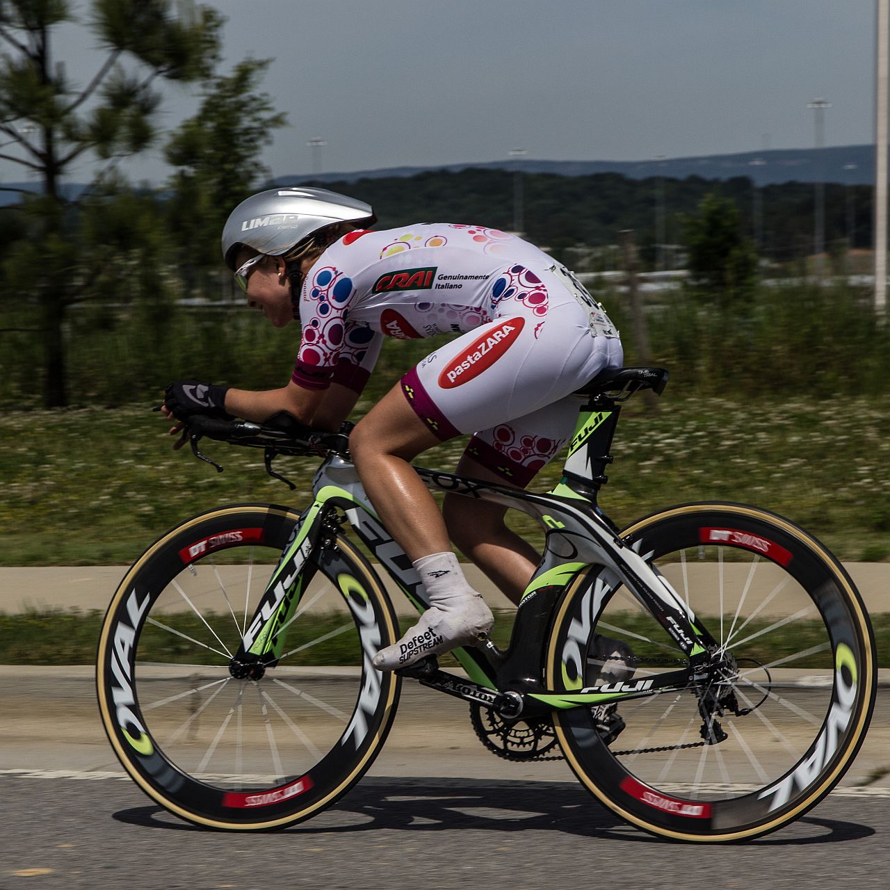 an athlete is racing his bike during the competition