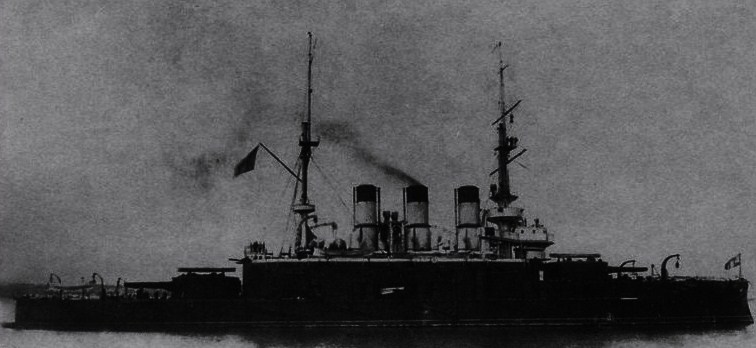 a large black ship with many chimneys on the back