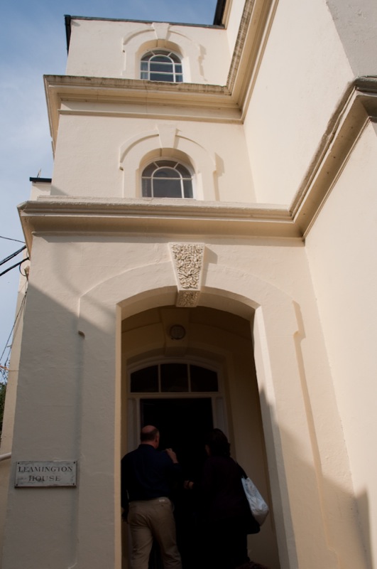 two people walking out of a church doorway