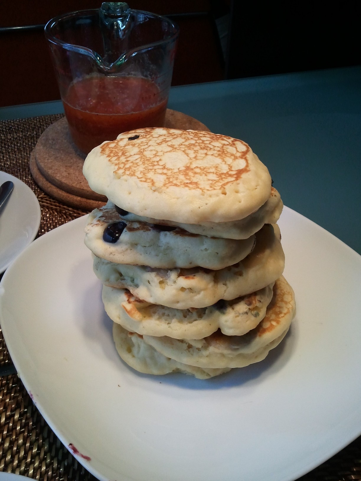 a stack of pancakes on top of a white plate