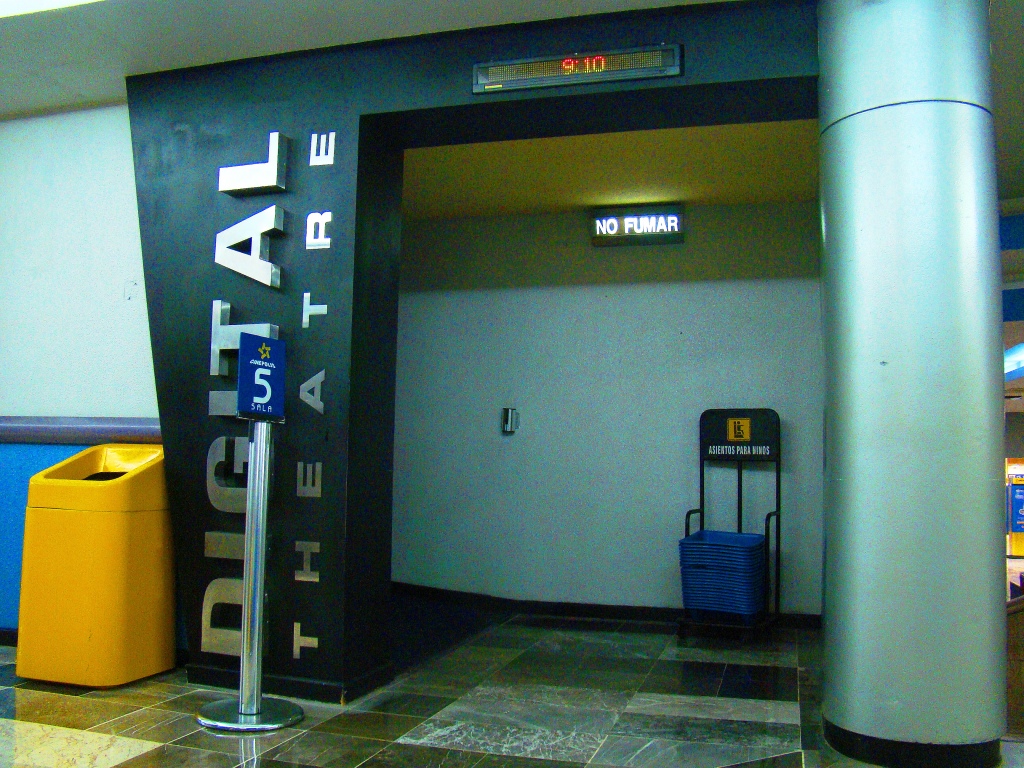 an entrance to a terminal is marked with the word travel