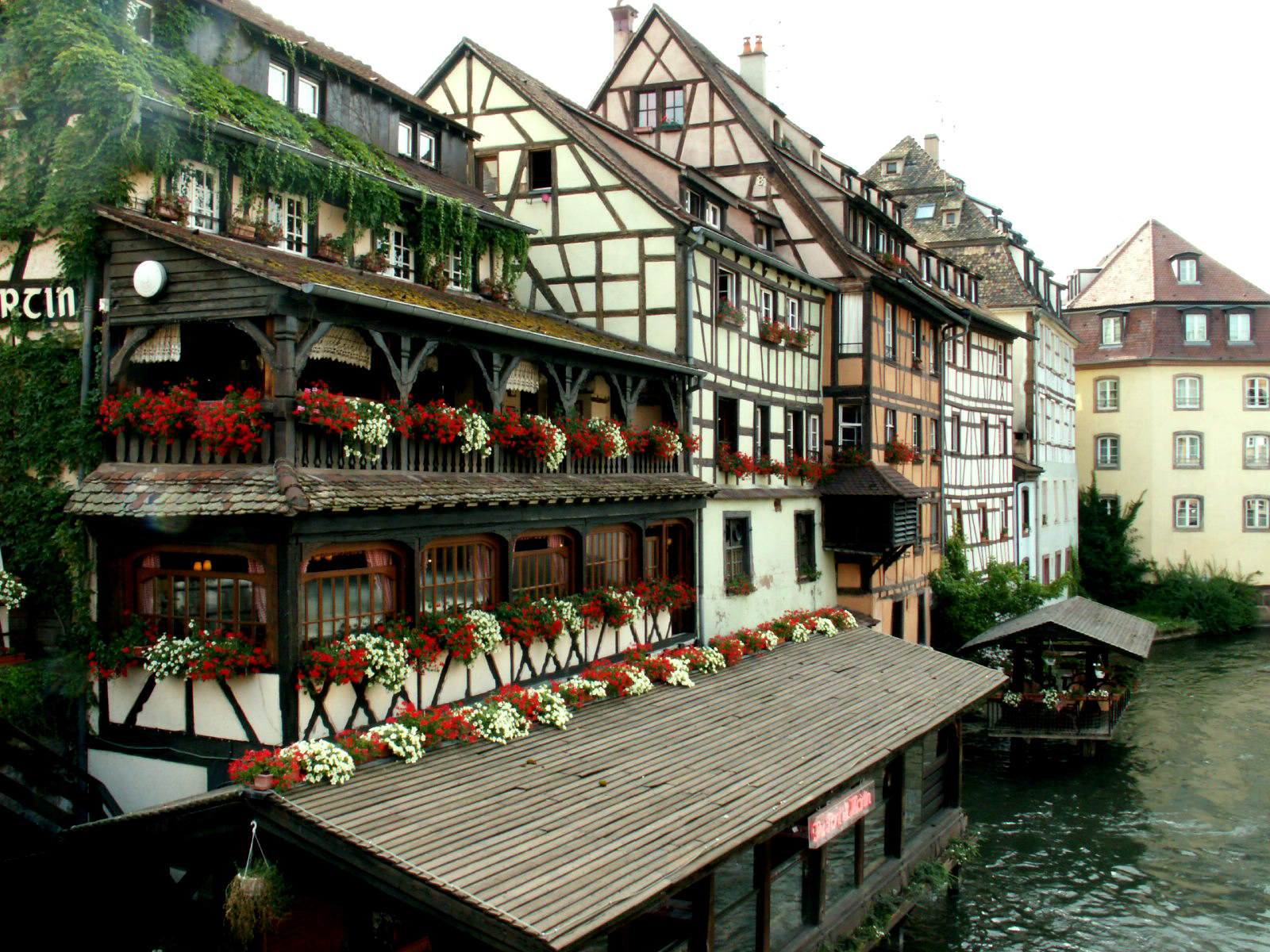 some buildings are in the daytime with a river running through them