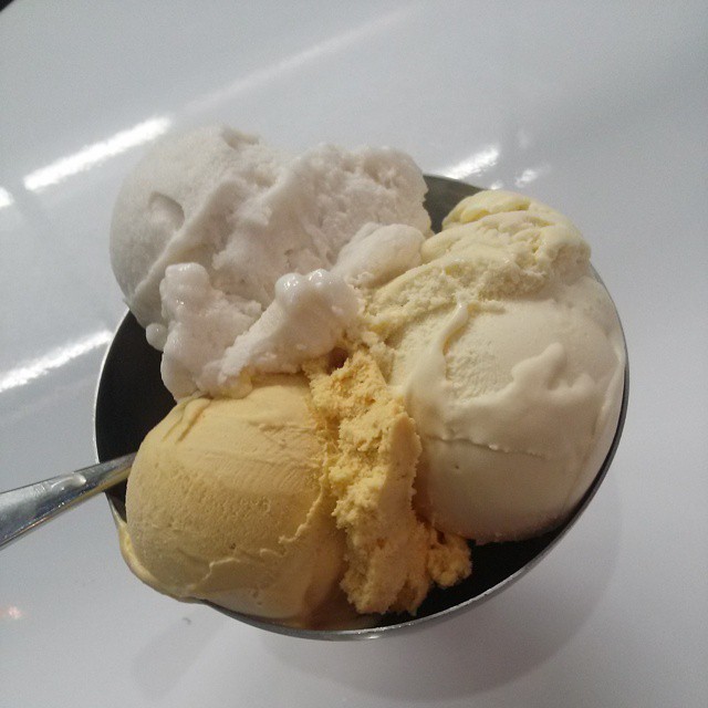 two scoops of ice cream are shown in a silver bowl
