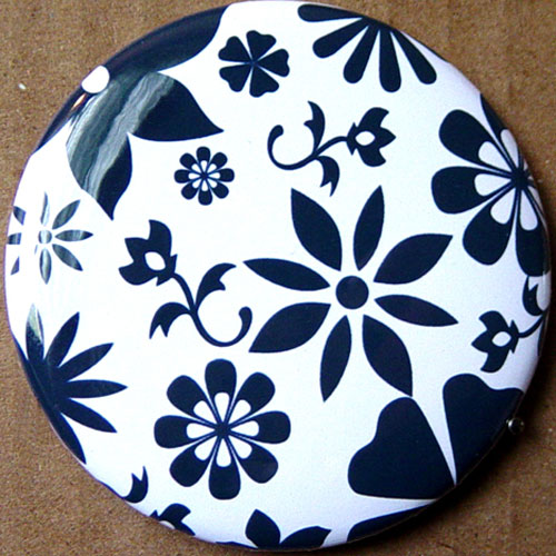 the back of a on that is decorated with black and white flowers