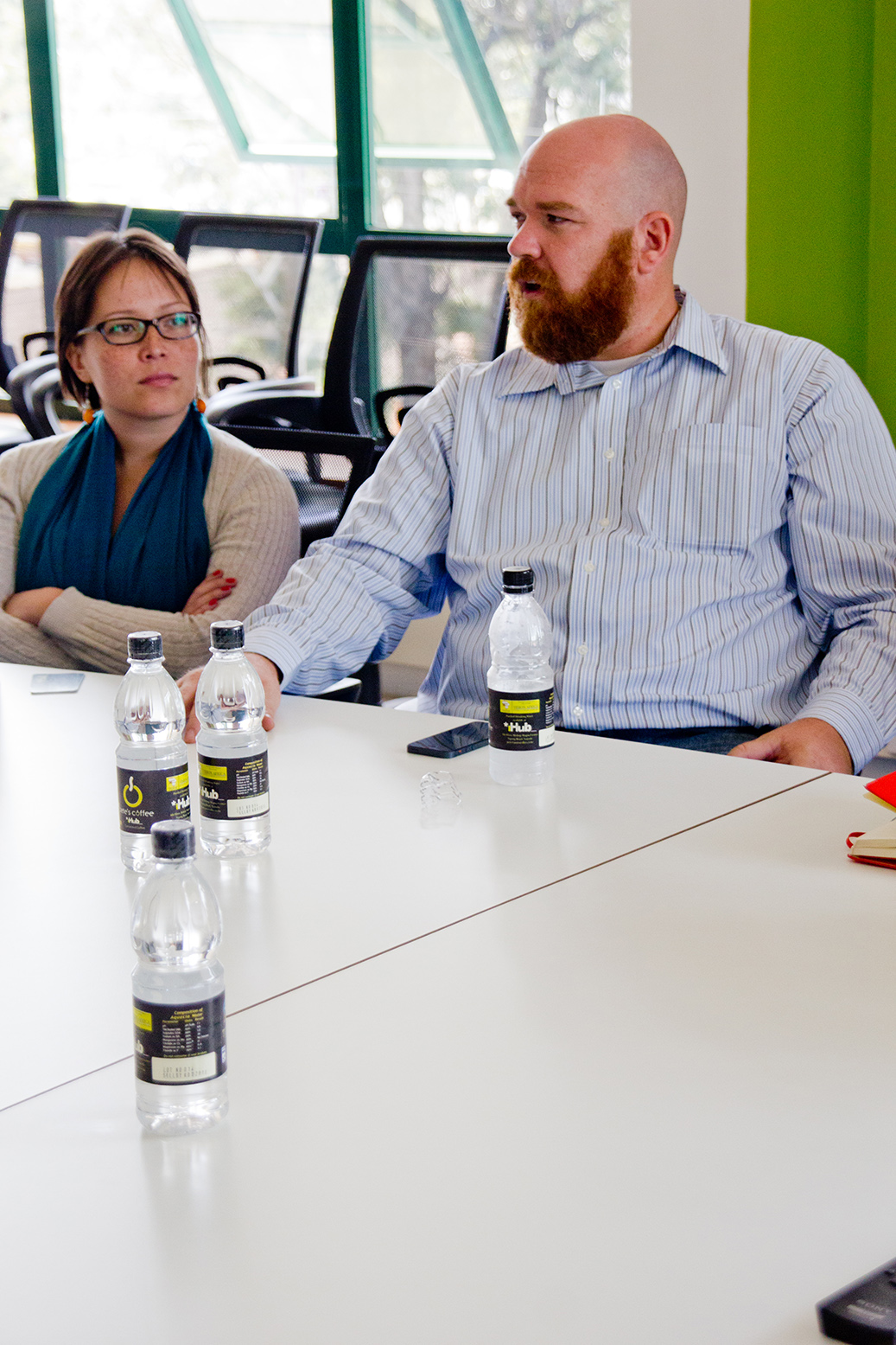 two men and two women in a meeting