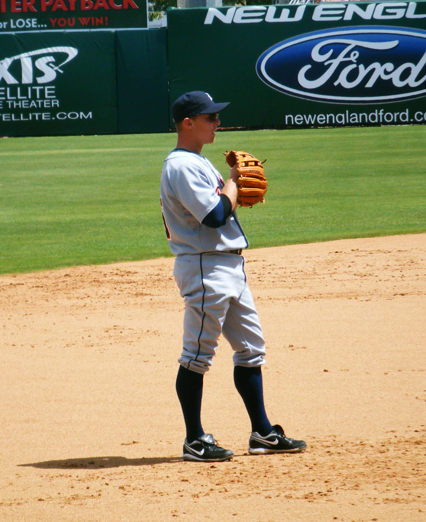 a baseball player is standing on the pitcher's mound