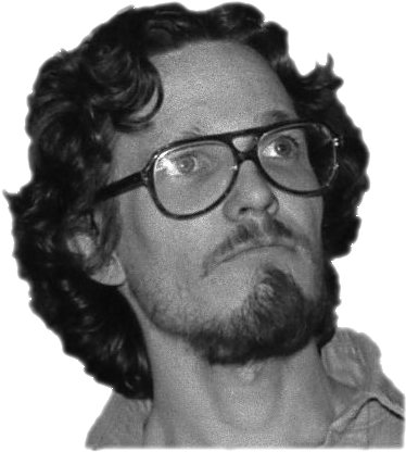 a man with curly hair and glasses looks into the camera