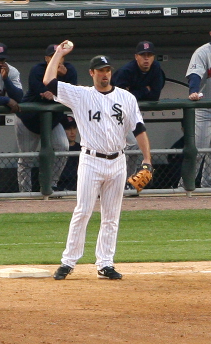 a man standing on a field wearing a baseball uniform