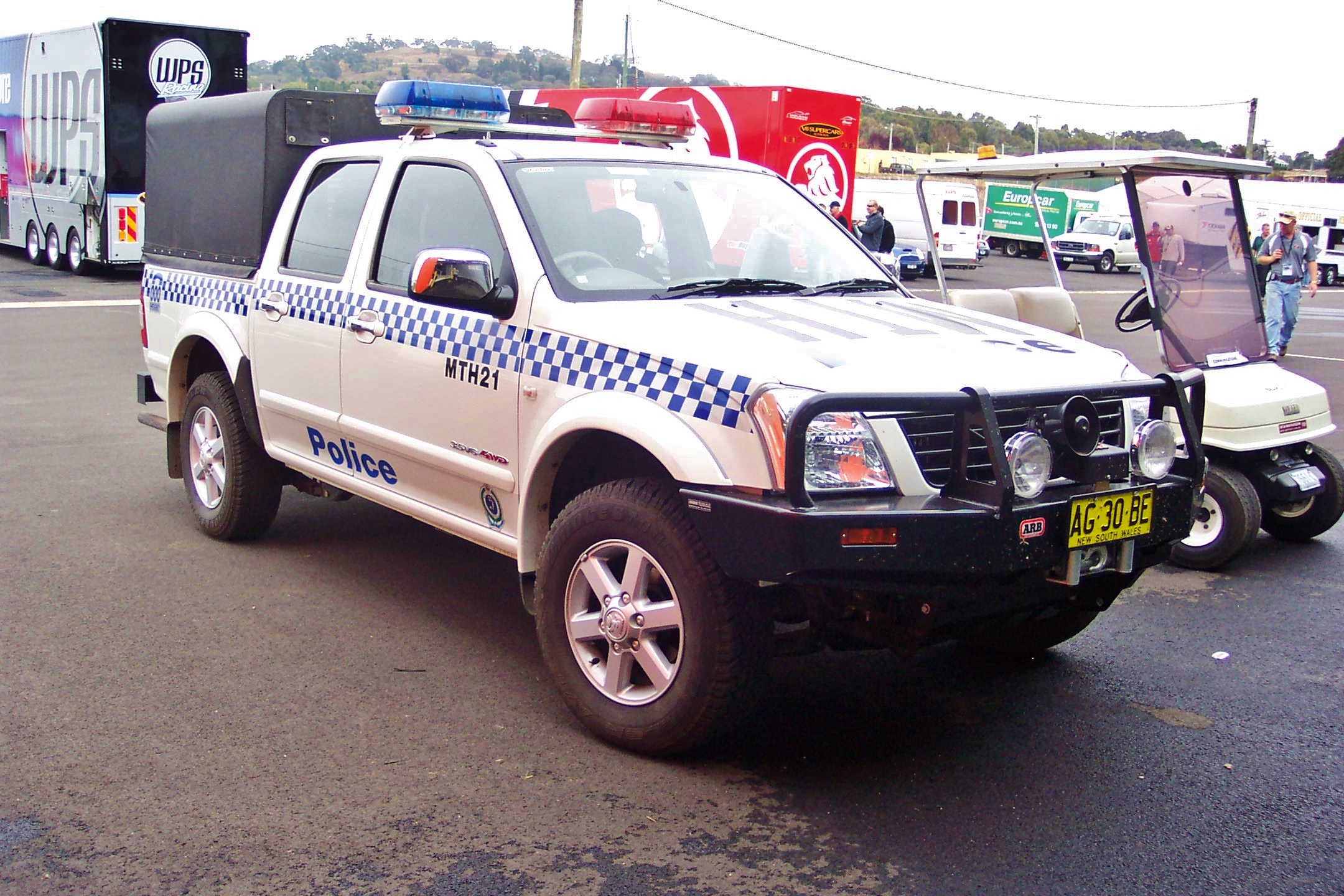 a pickup truck parked on the side of the road