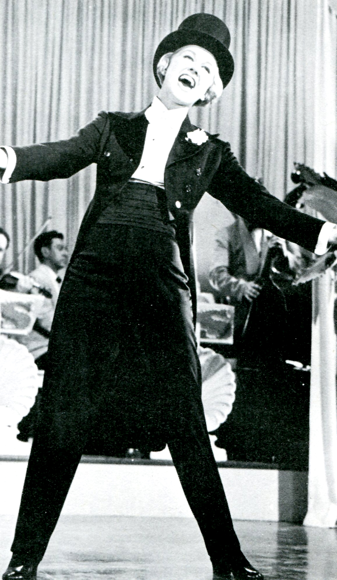 a man dancing in an event with his arms outstretched
