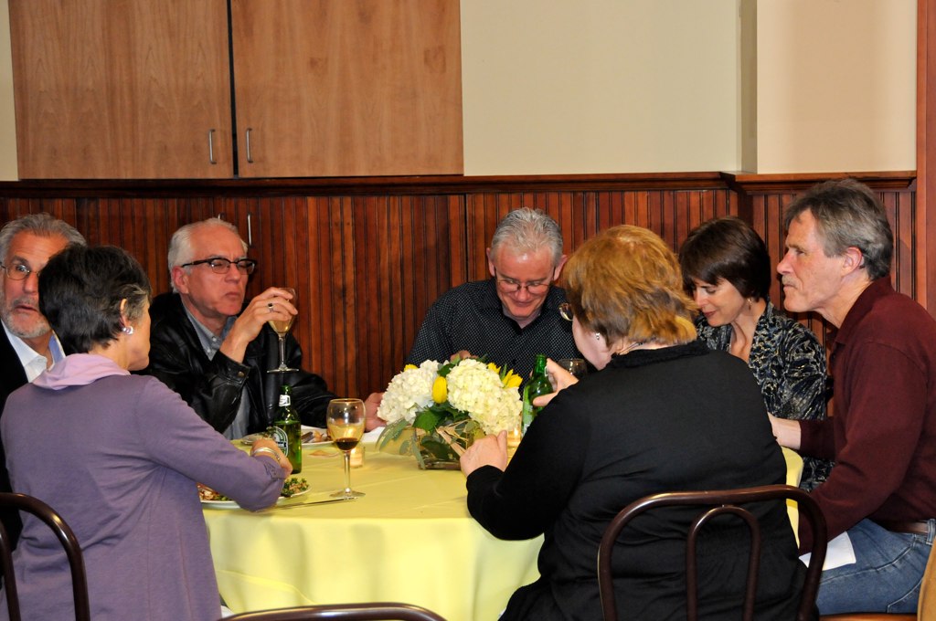 a group of people sitting around a table