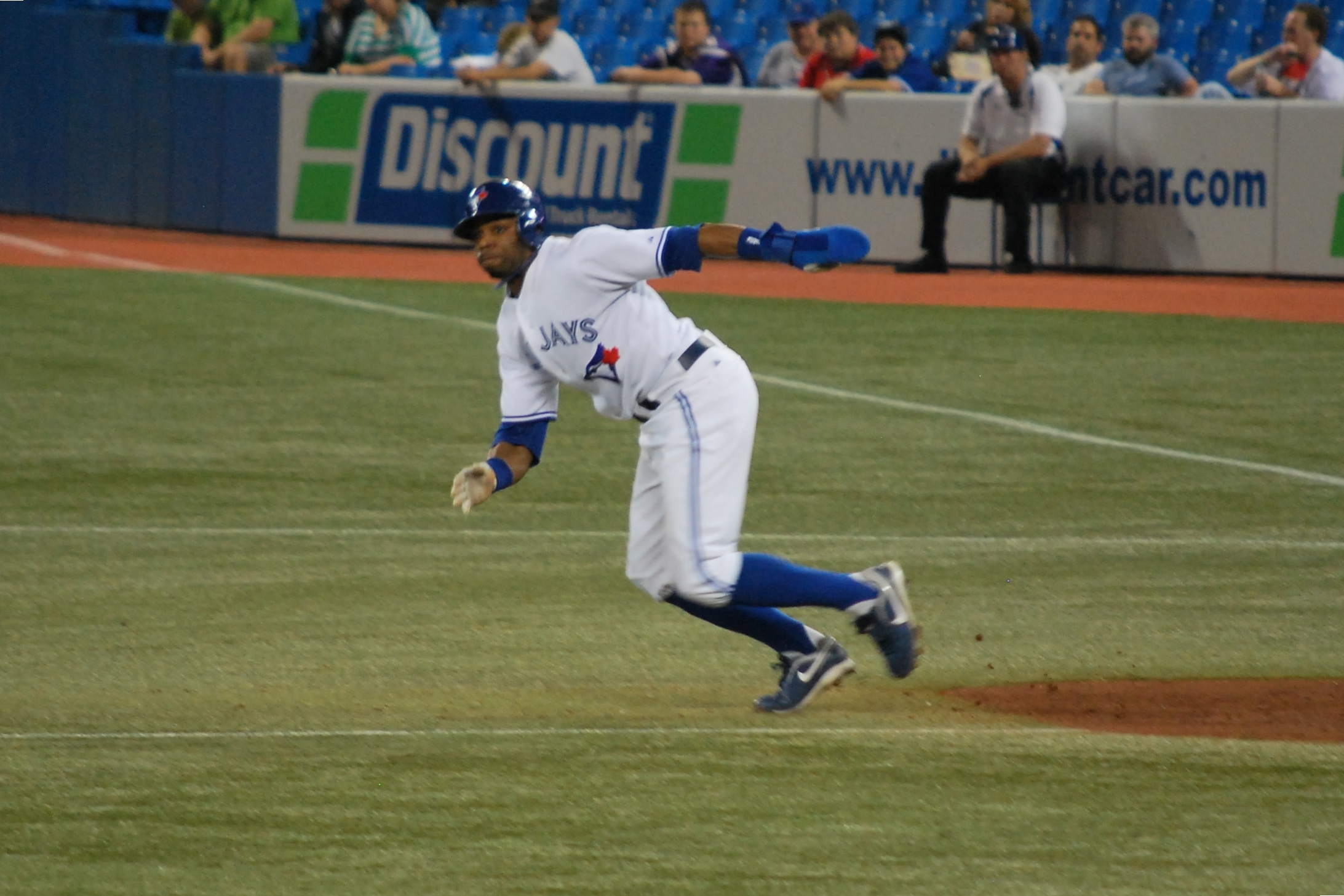 the man is catching the ball with his leg