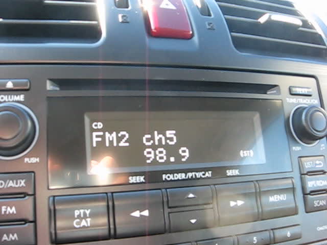 a radio is on a car dashboard with an appliance