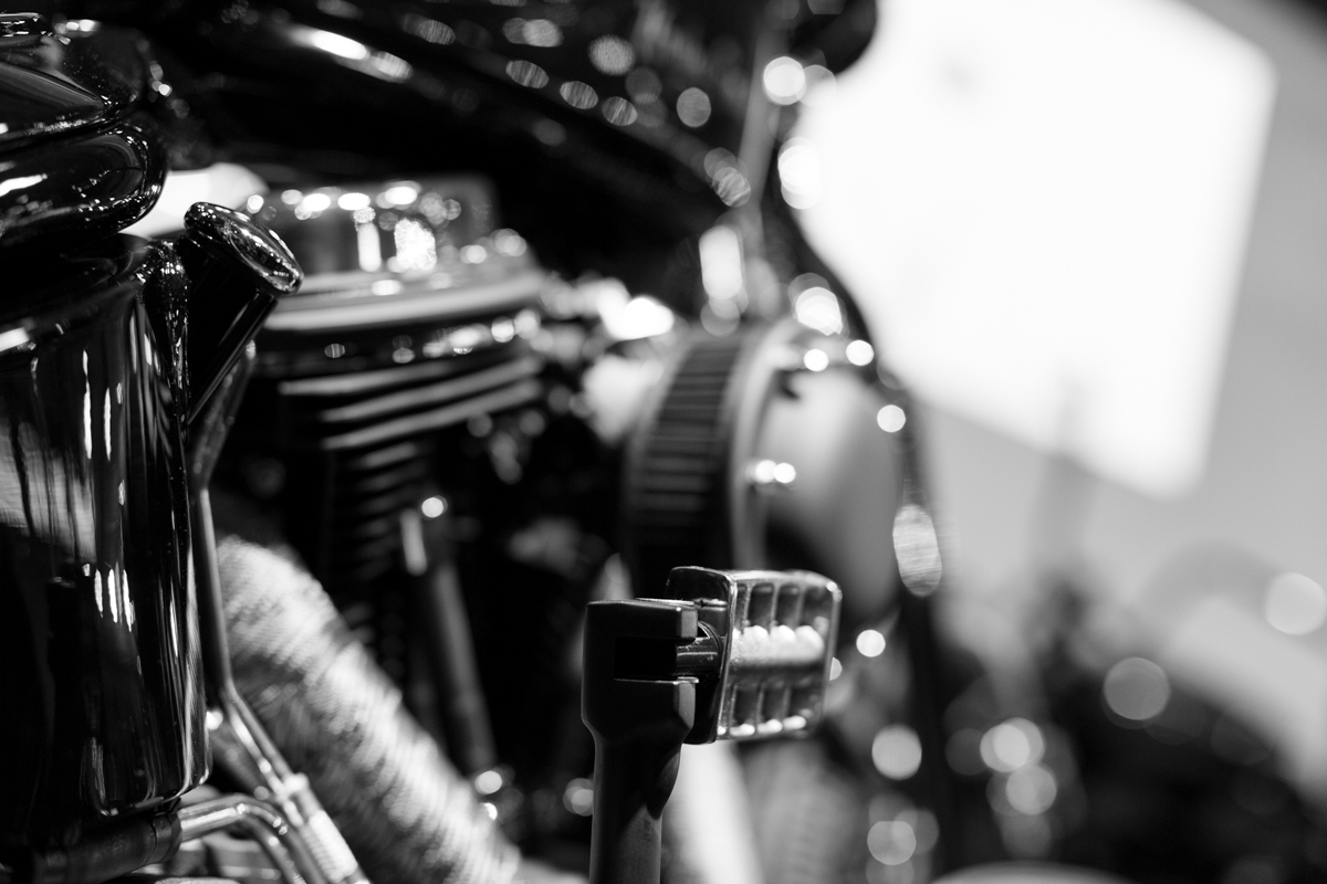 closeup of a motorcycle engine from the side view mirror