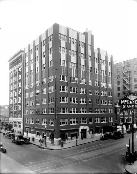 an old black and white po of the menage building in the late twentieth century